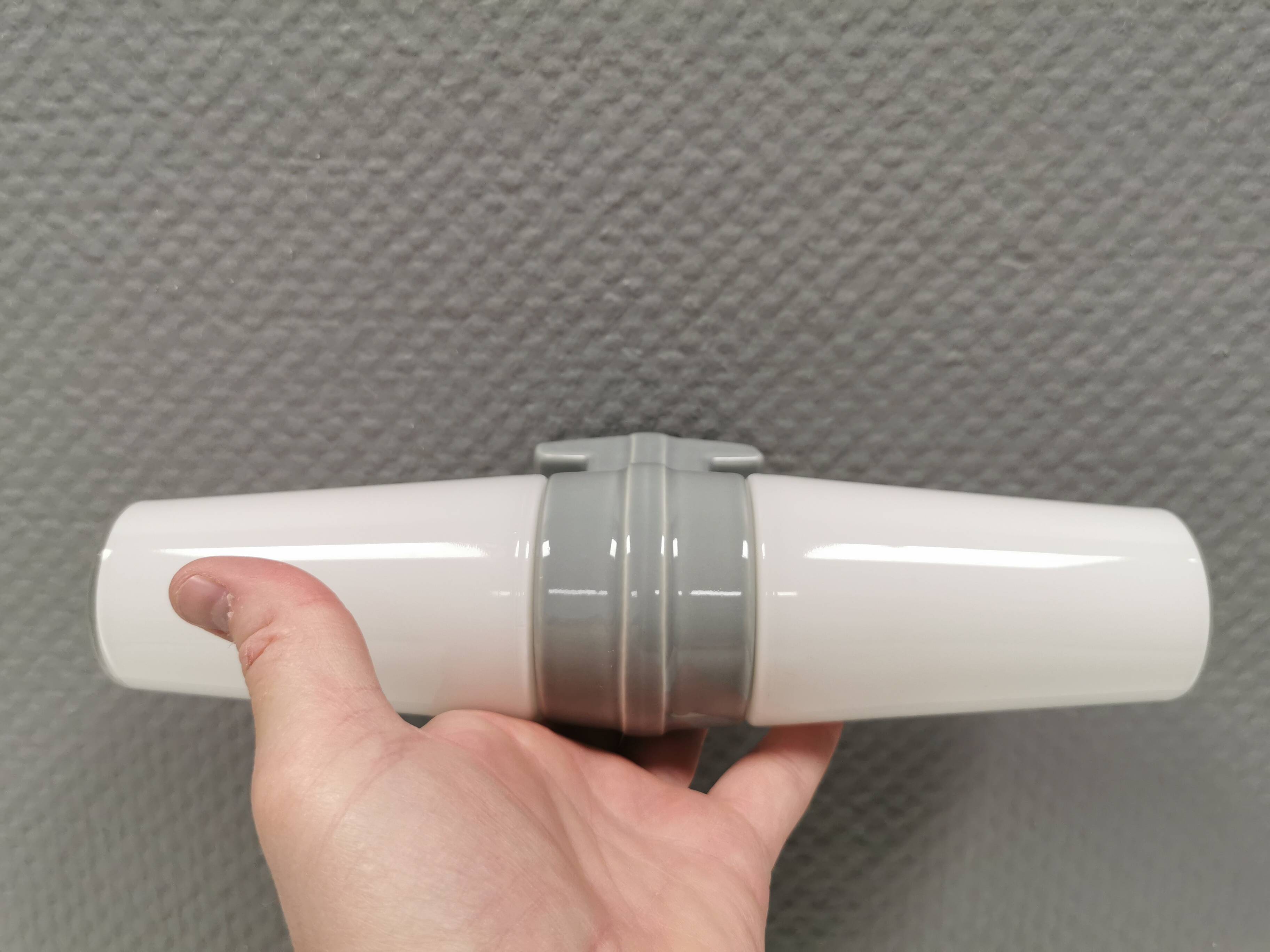 Bathroom lamp with light gray ceramic base,  and milky white opal glass.