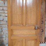 Old communication door with wood effect paint
