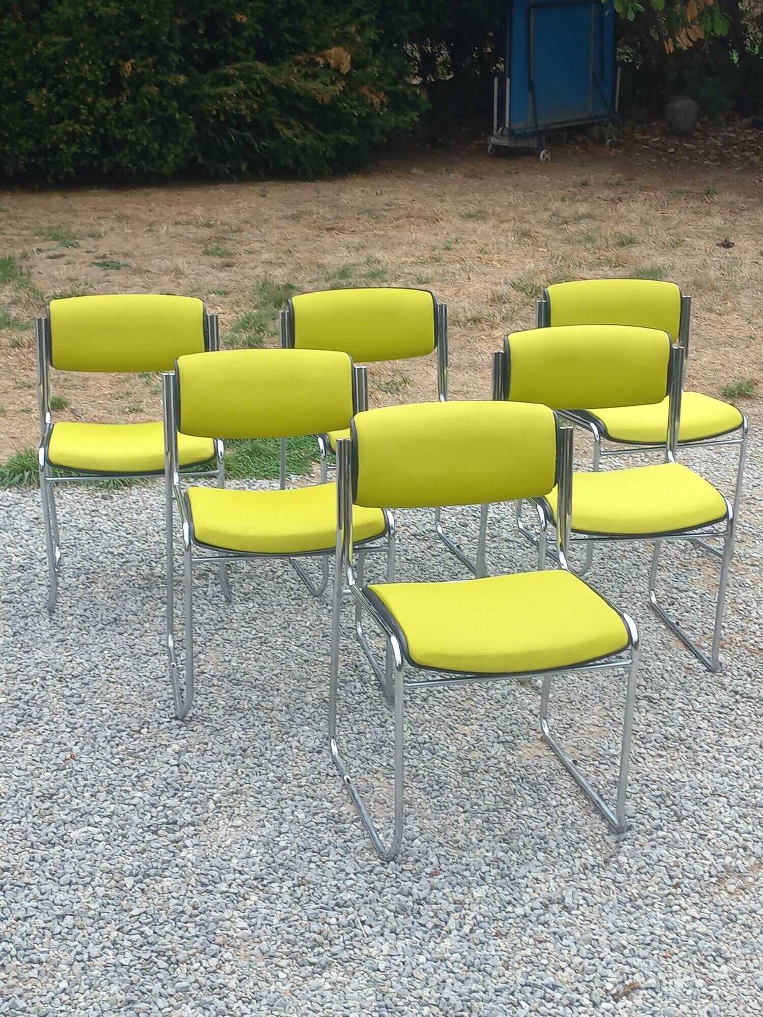 Set of 6 designer chairs with wooden seats and backs, chrome legs.