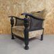 Old armchair upholstered in velvet, carved and caned wood