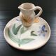 Set plate and jug with floral decoration.