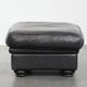 Large and timeless black ottoman made of cowhide leather in English style
