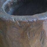 Antique hand carved mortar coffee table with circular glass top