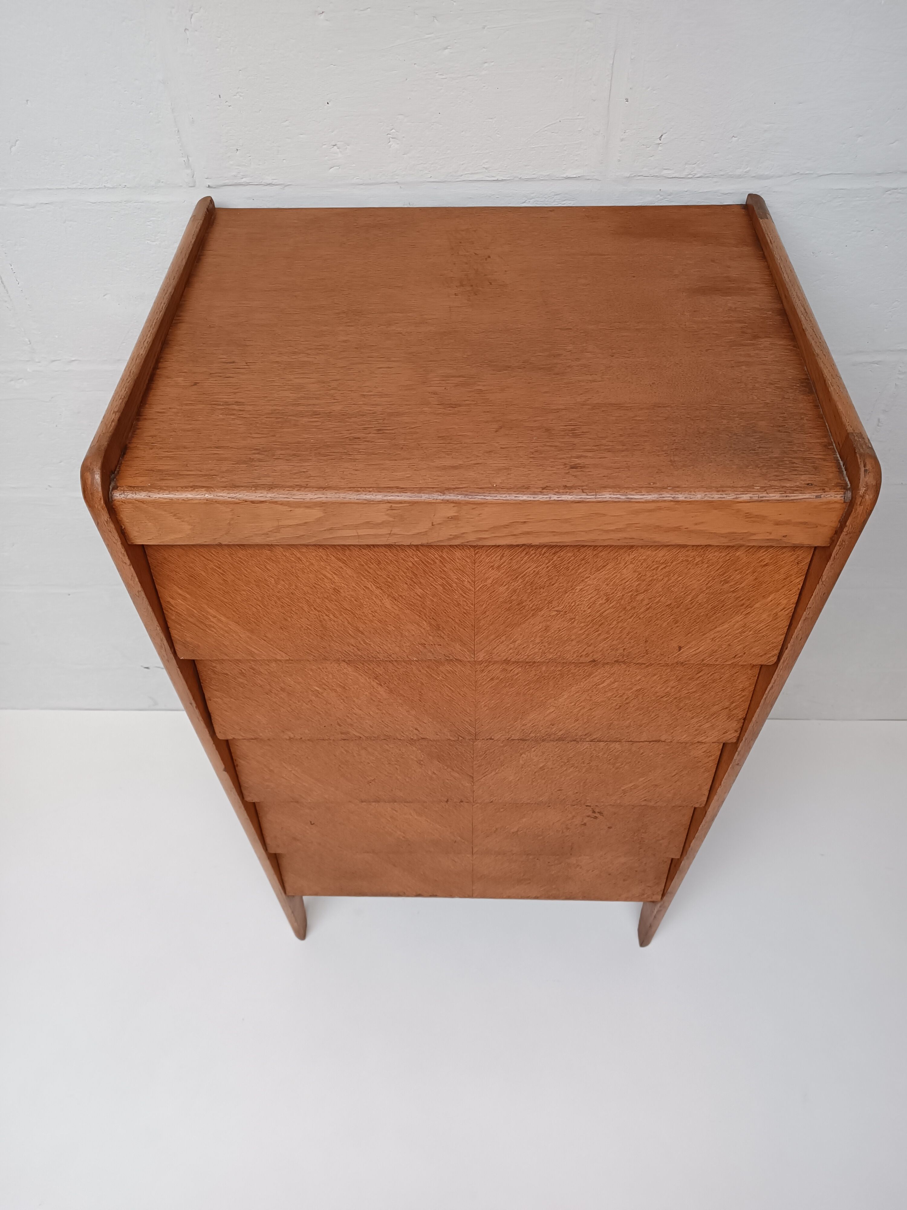 High wooden chest of drawers in the 50s