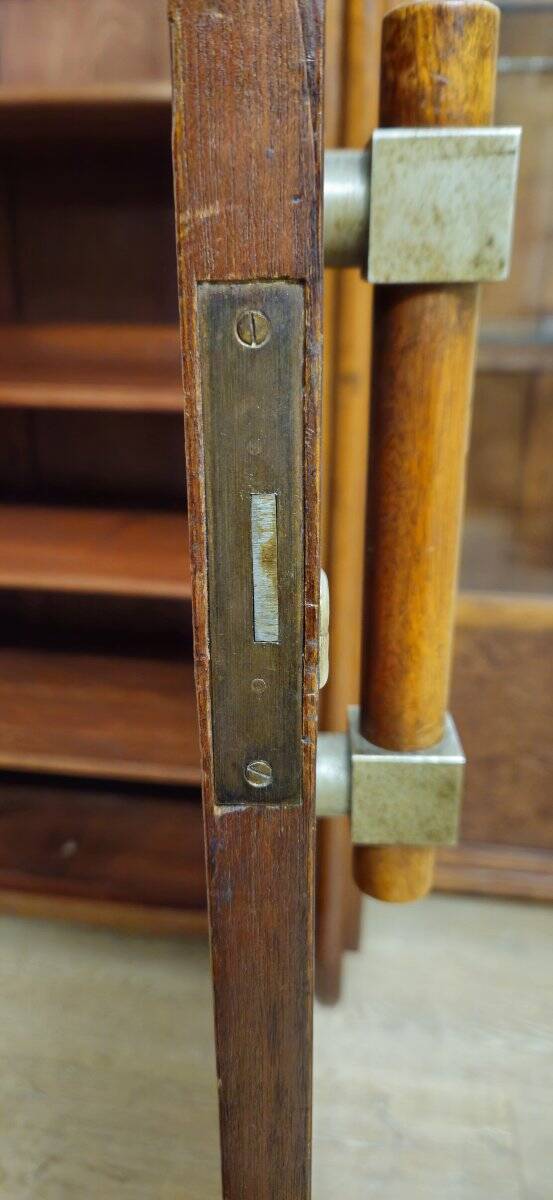 Important Art Deco library in amboyna and mahogany veneer.