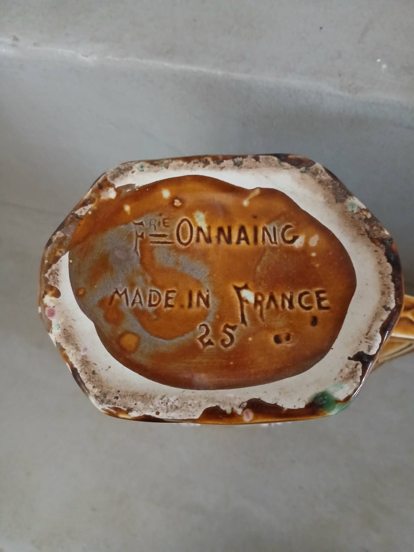 Antique pitcher in Onnaing slipware