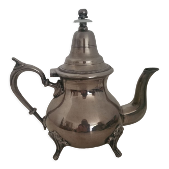 Oriental teapot in silver metal