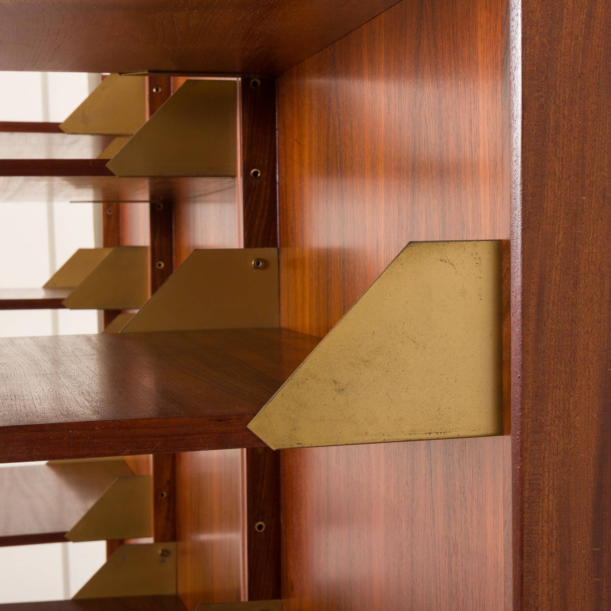 Italian mid-century teak wall unit on panels, 1970s