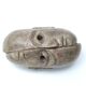 Patinated plaster sculpture paper press: Inverted faces