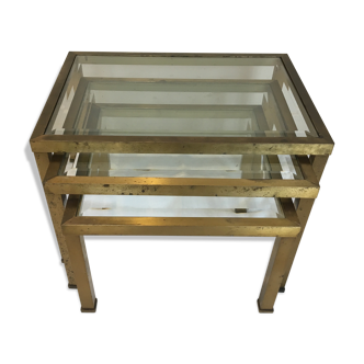 Pull-out tables in glass and brass