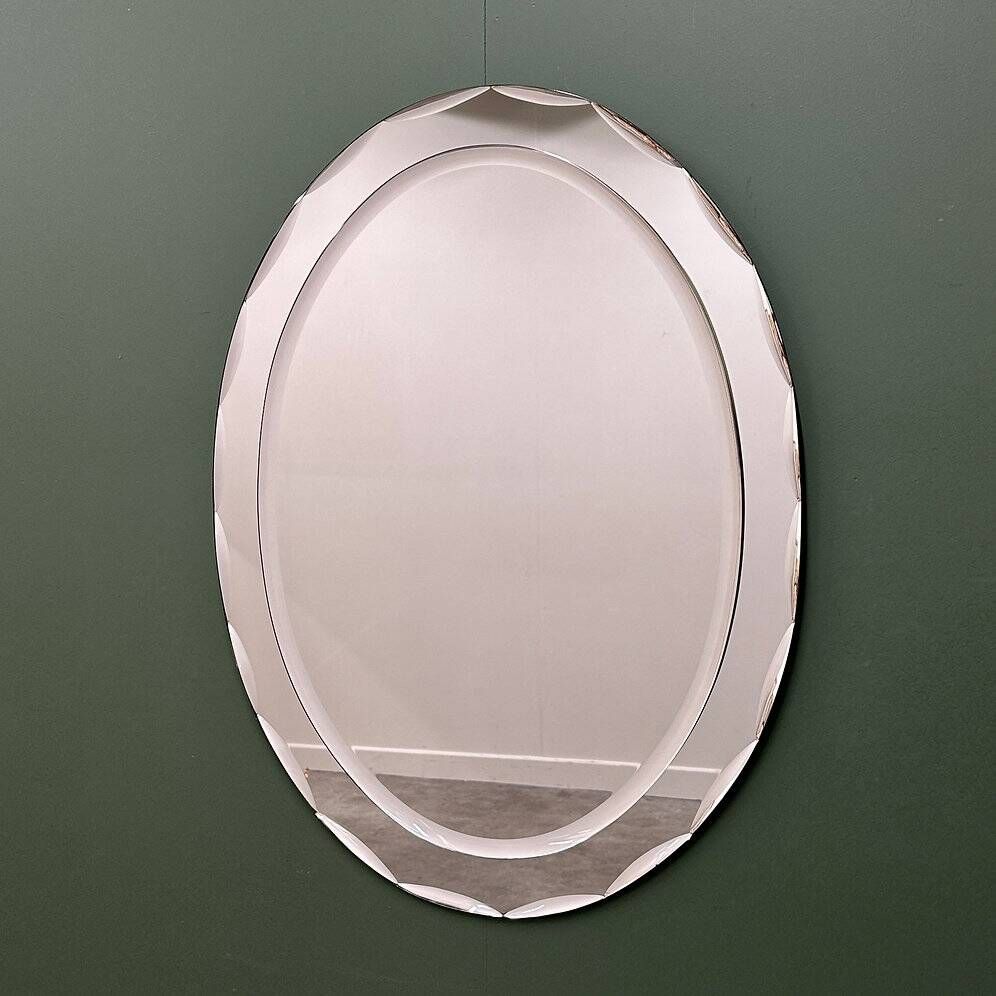 1970s Italian oval mirror by Crystal Arte with faceted glass frame
