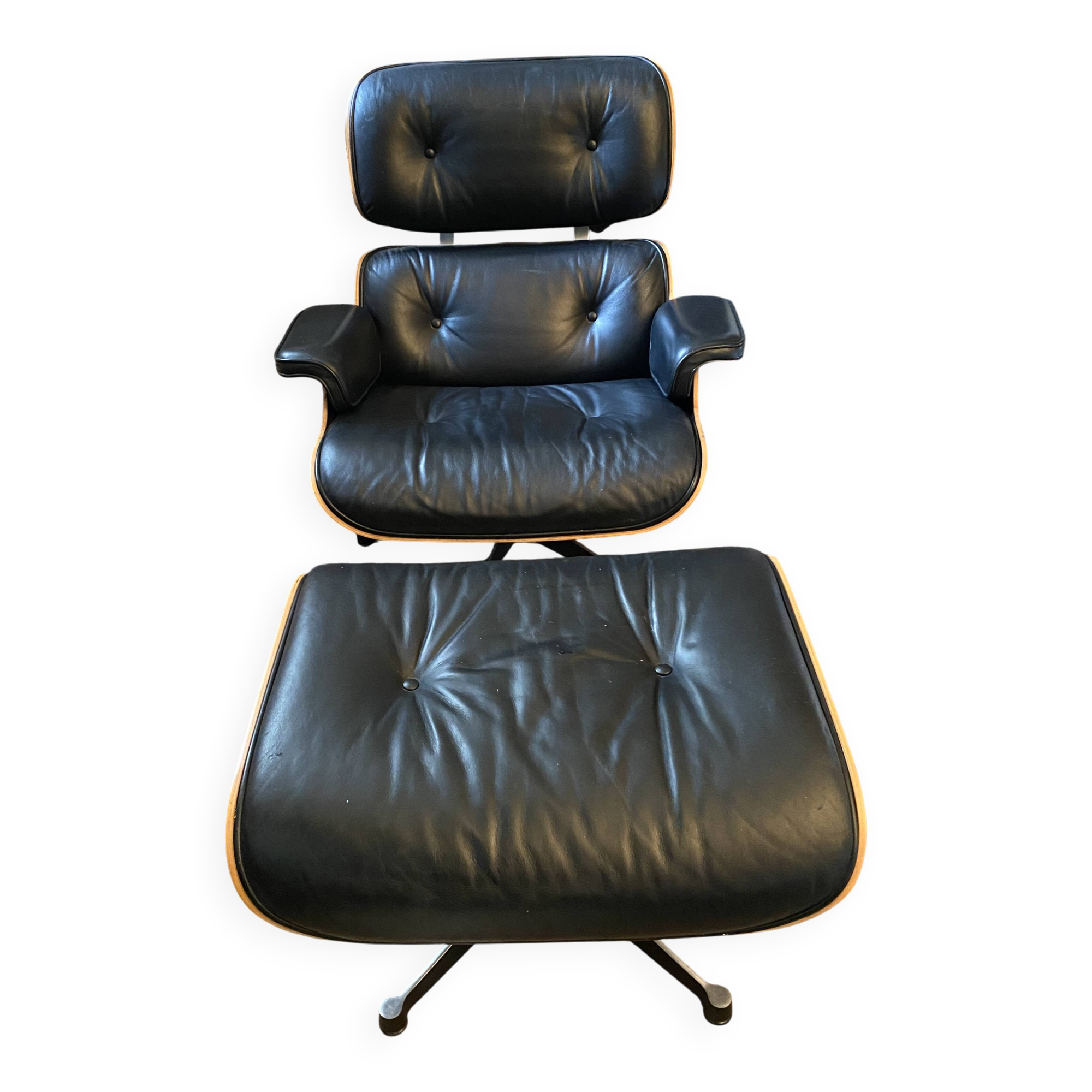 Black leather Eames Vitra armchair, original with rosewood ottoman.