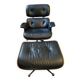 Black leather Eames Vitra armchair, original with rosewood ottoman.