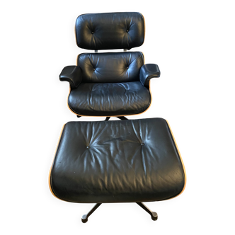 Black leather Eames Vitra armchair, original with rosewood ottoman.