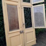 Porte d'entrée cintrée double en chêne, grilles et verre, XIXème