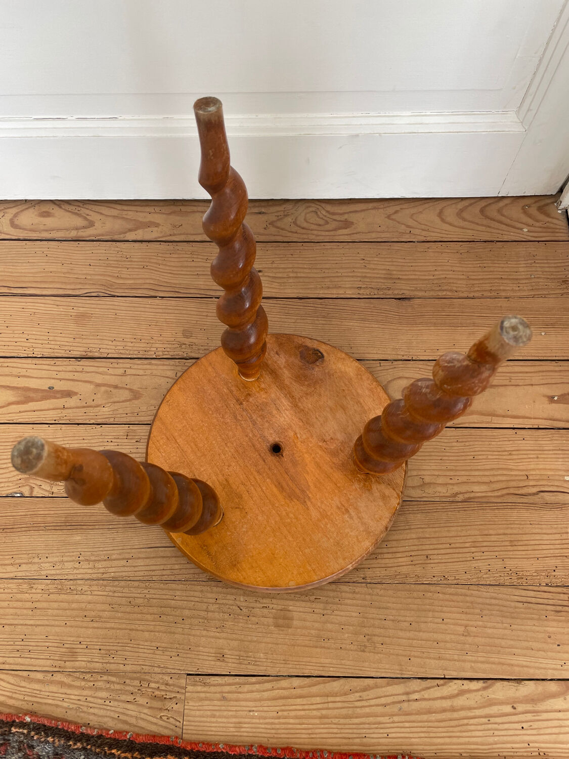 Vintage tripod stool with turned feet