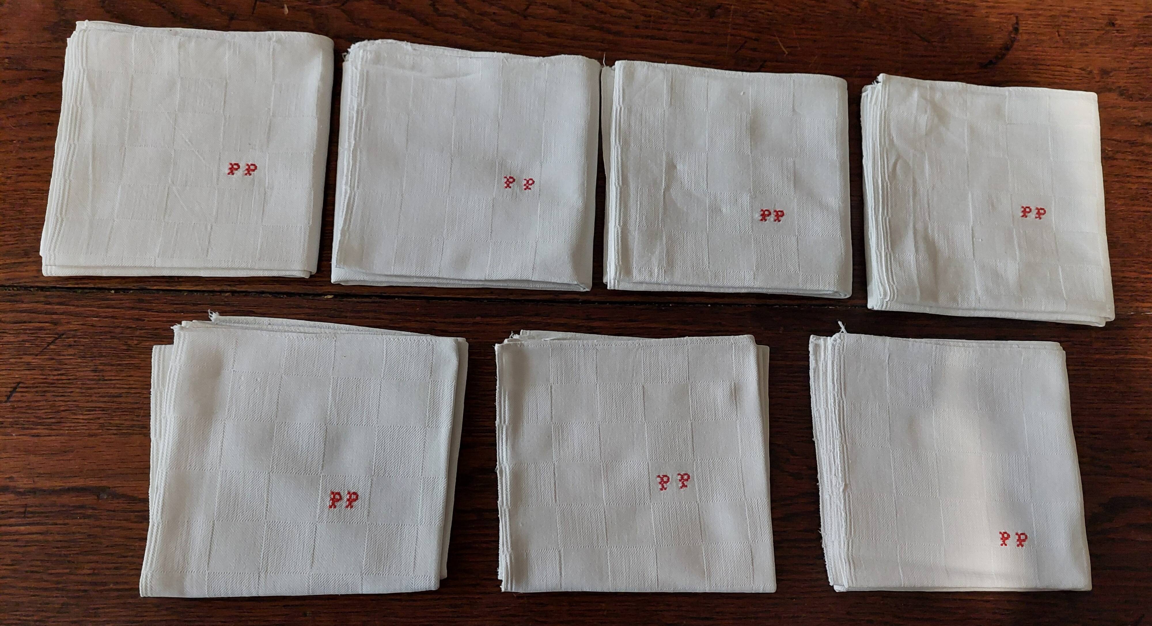 Set of seven monogram PP damask cotton napkins 56 x 56 cm