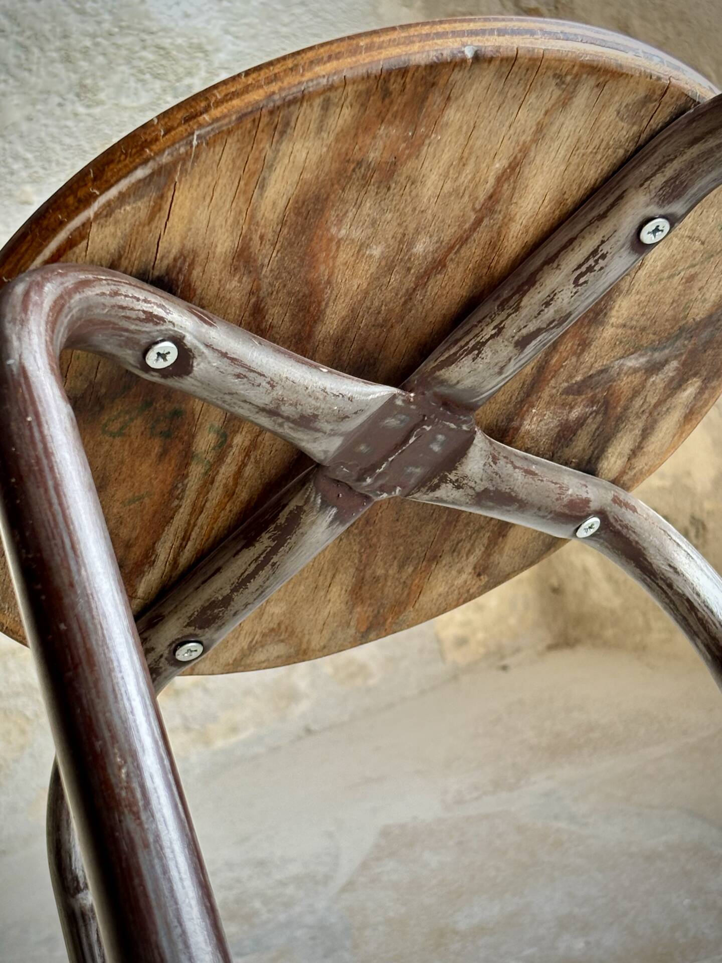 Old workshop stool in steel and beech