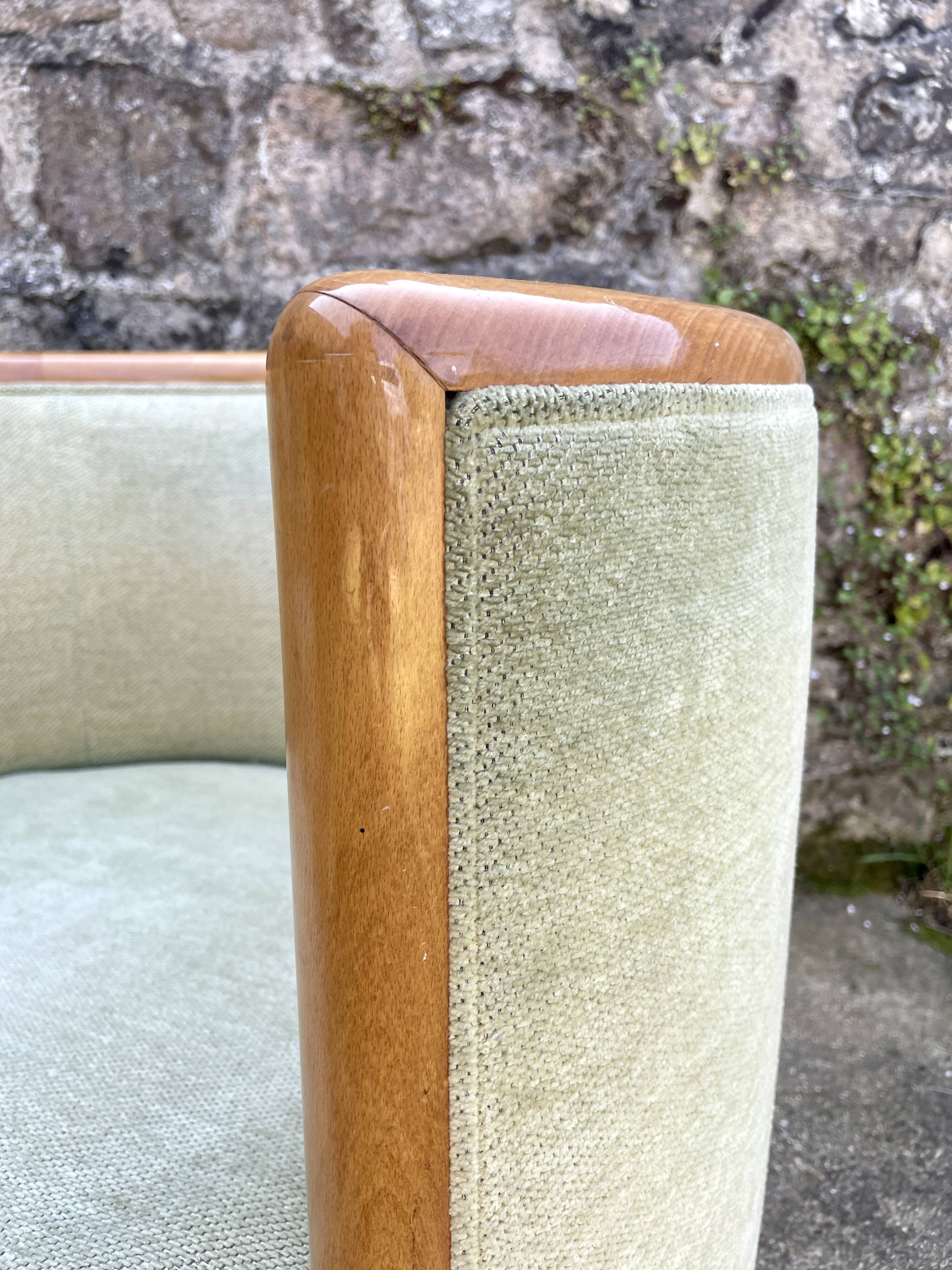 Pair of barrel-shaped armchairs in beech and almond green velvet by Maison Rosello