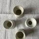 Set of 4 white porcelain diabolo shells