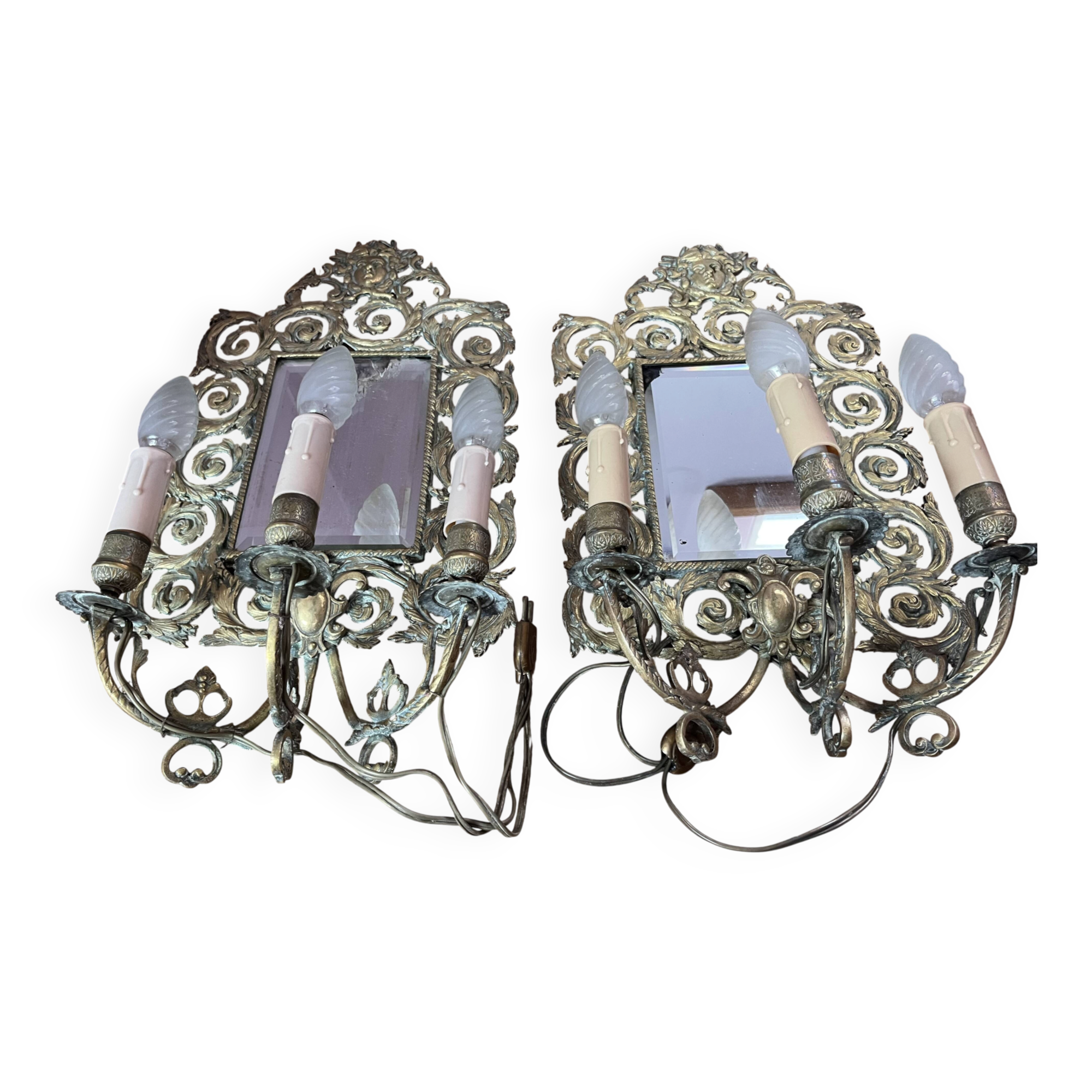Pair of Napoleon III wall sconces, bevelled mirrors, mask heads.