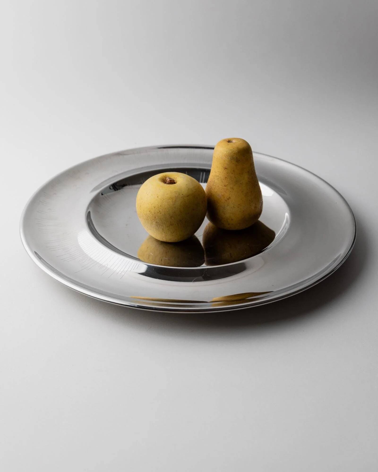 Vintage stainless steel bowl from the 1980s, polished metal with a finely textured surface, timeless elegant design, retro table decoration, noble gift idea.