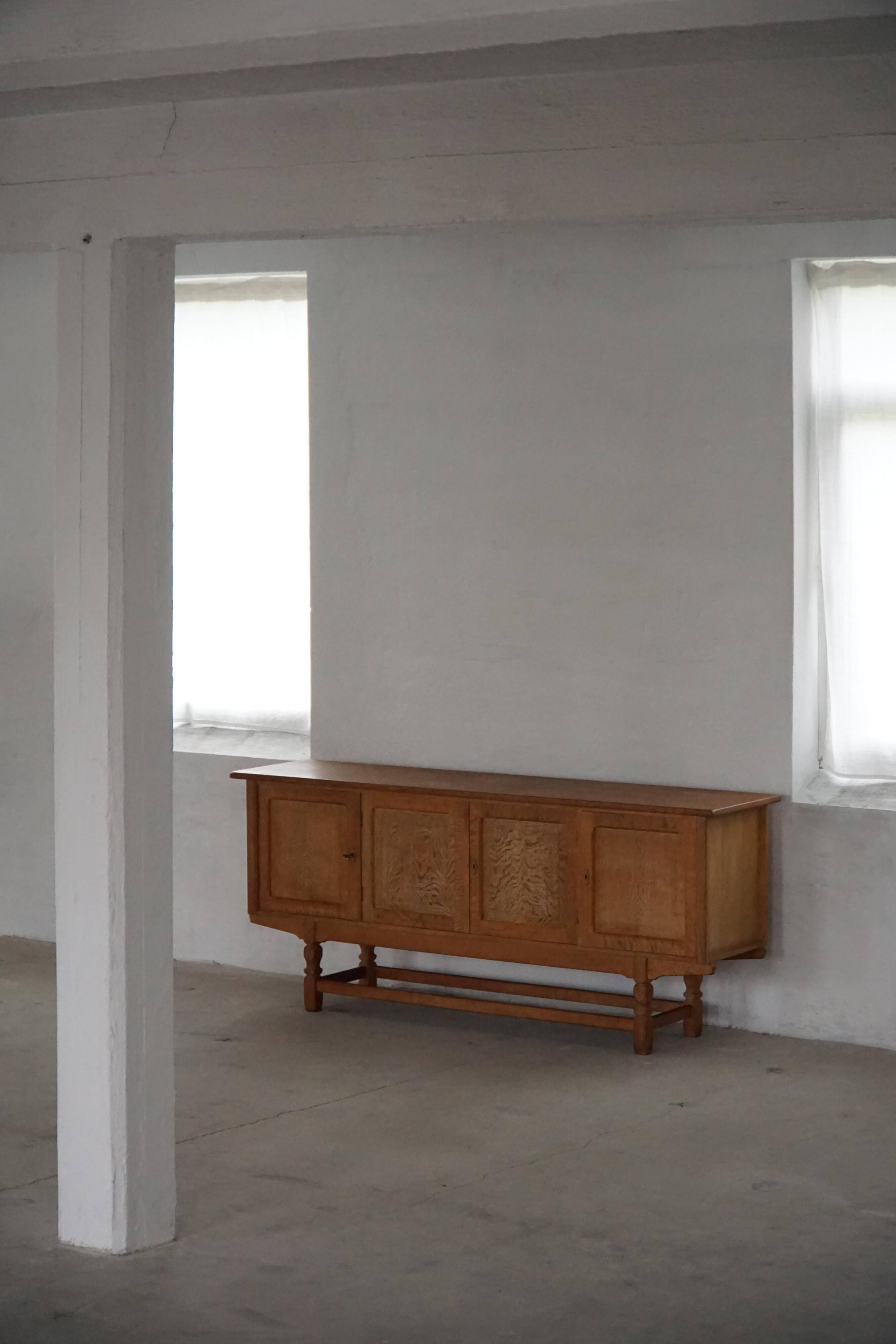 Low oak sideboard, mid-century modern, made by a Danish cabinetmaker, 1960s.