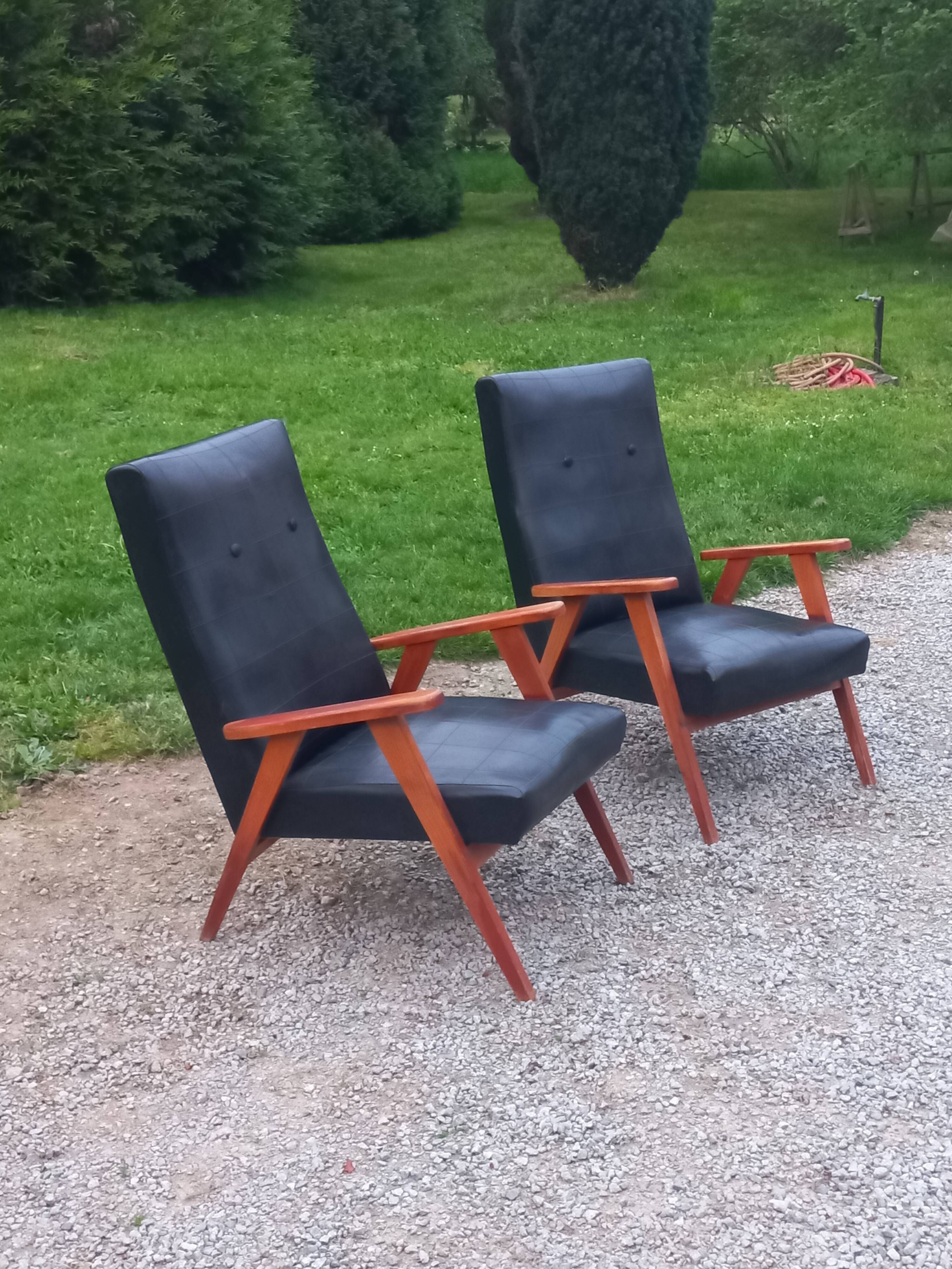 Pair of vintage beech armchairs feet compass covered with black moleskine from the 50s
