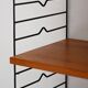 Scandinavian Hylla teak wall shelf with brass label