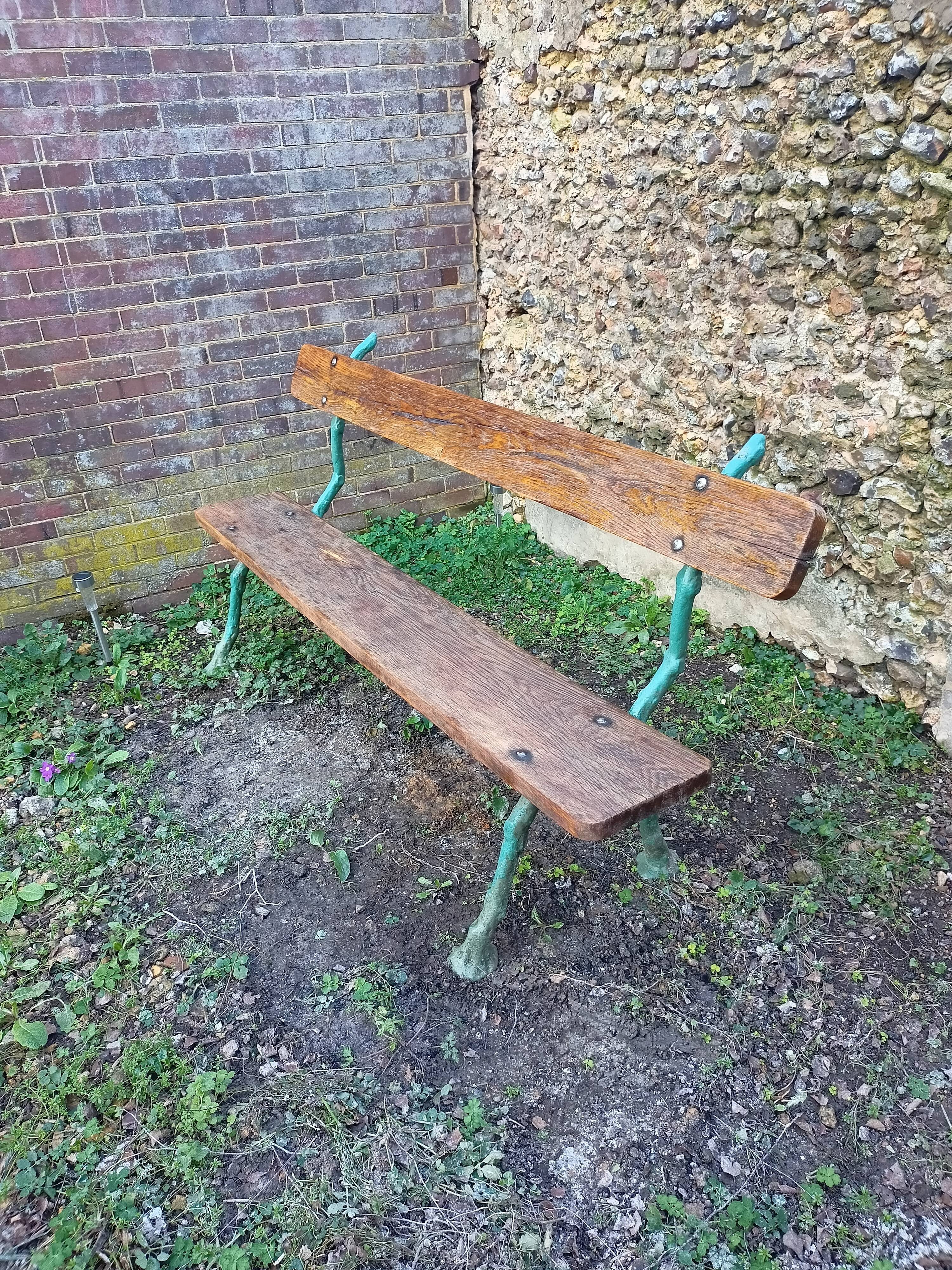 Green wood cast iron garden bench
