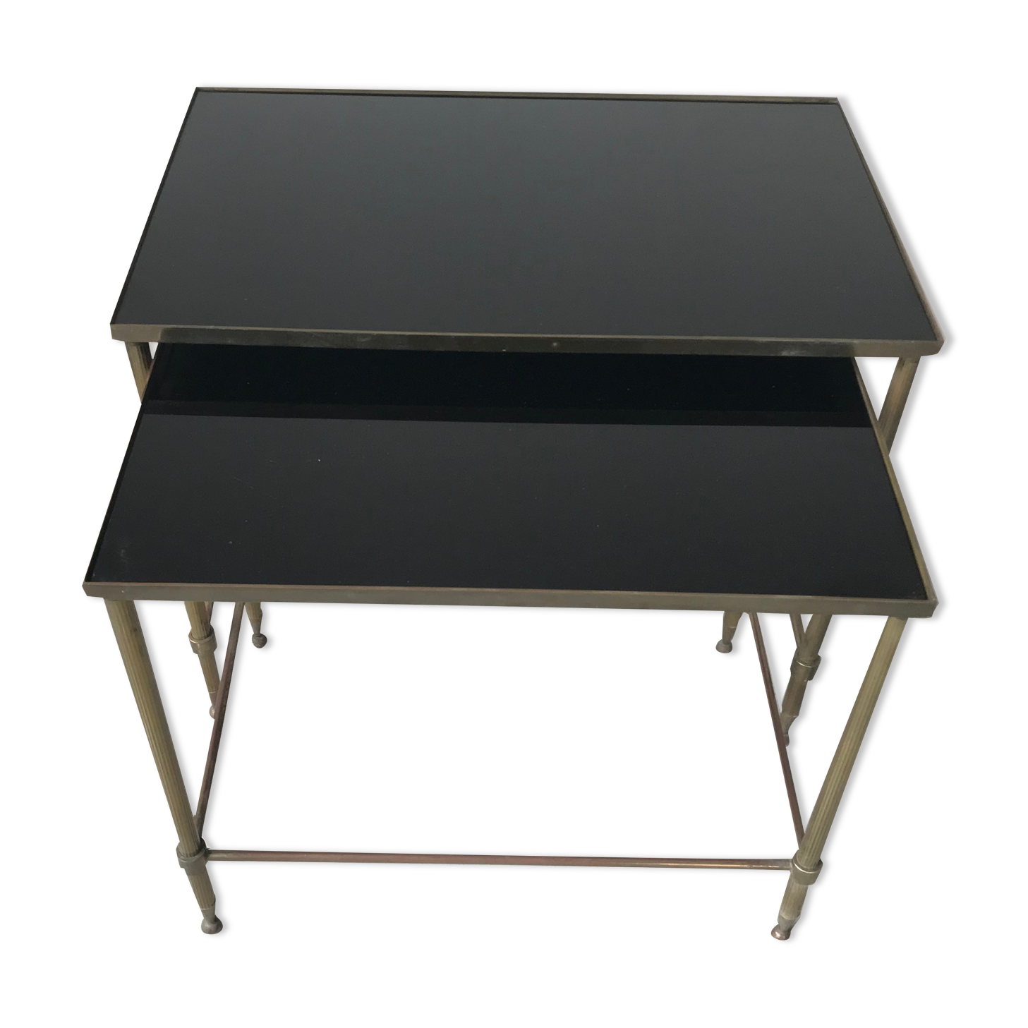 Pull-out tables in glass and brass