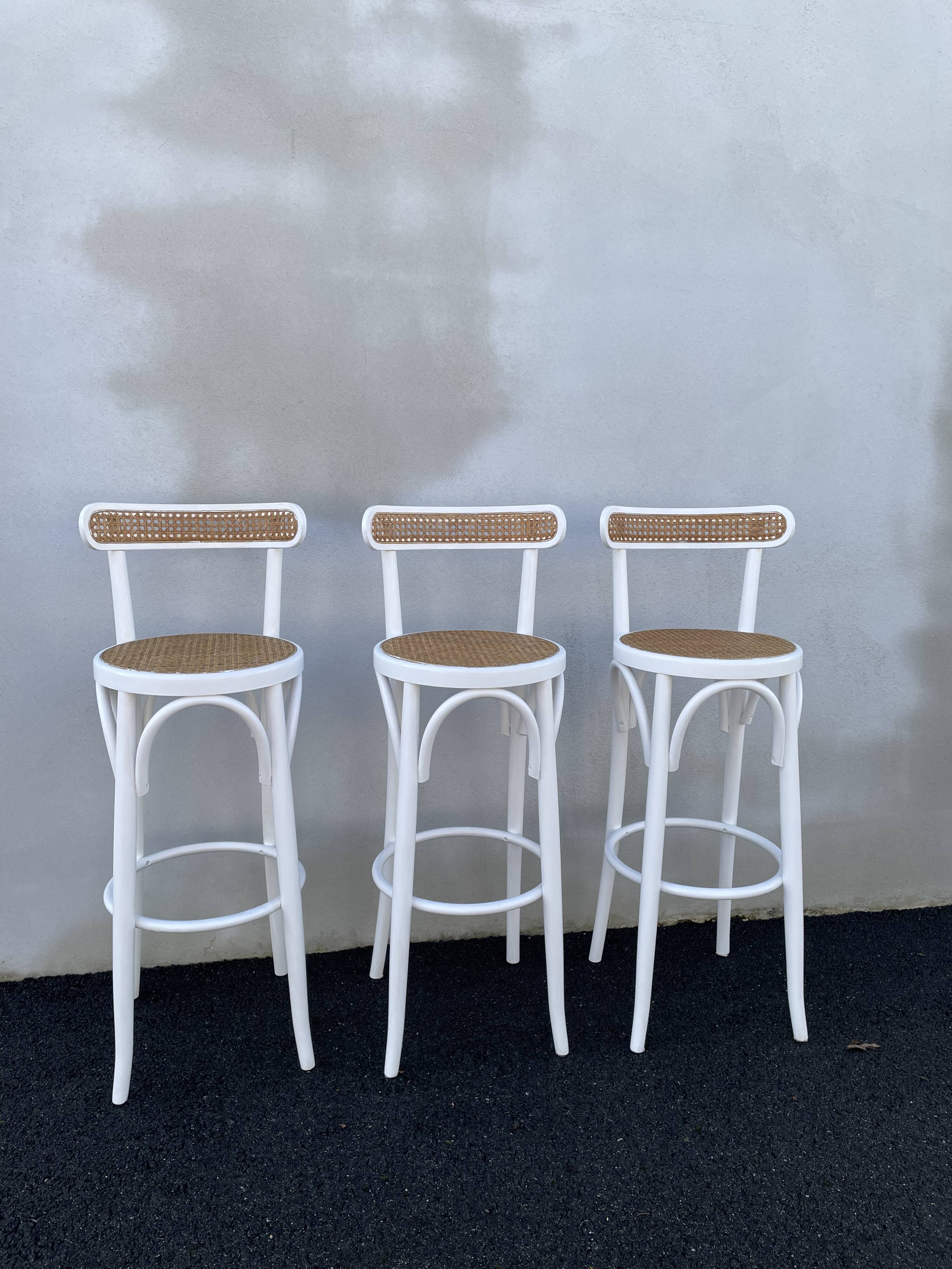 High stools in cane and curved wood 1970-1980