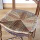 Antique chair with coloured rush seating.