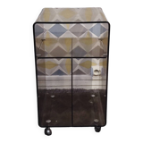 Michel Dumas smoked Plexiglas rolling table.