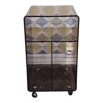 Michel Dumas smoked Plexiglas rolling table.