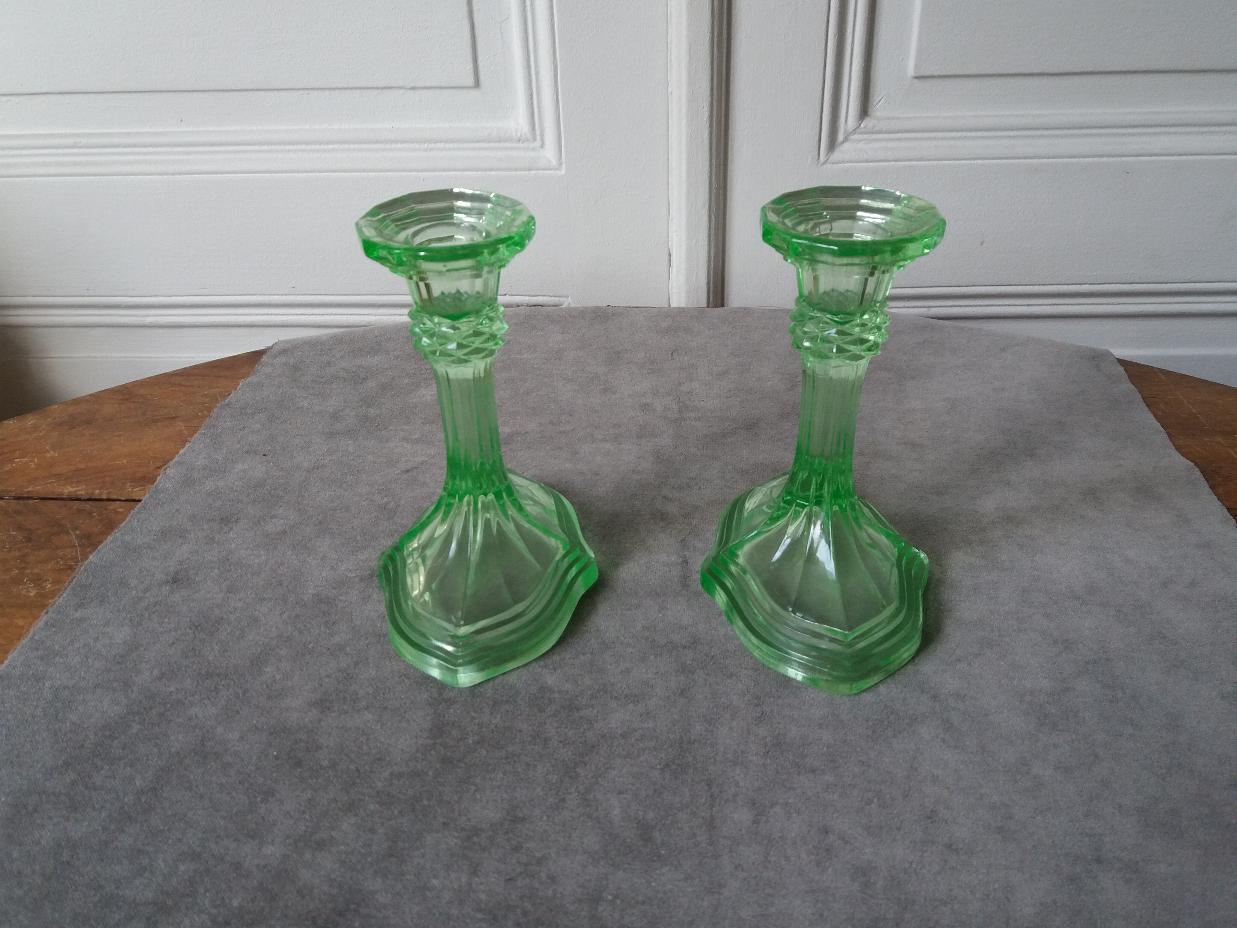 Pair of art deco candlesticks in molded pressed glass