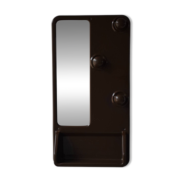 Wall mirror in moulded plastic with hooks and shelf.