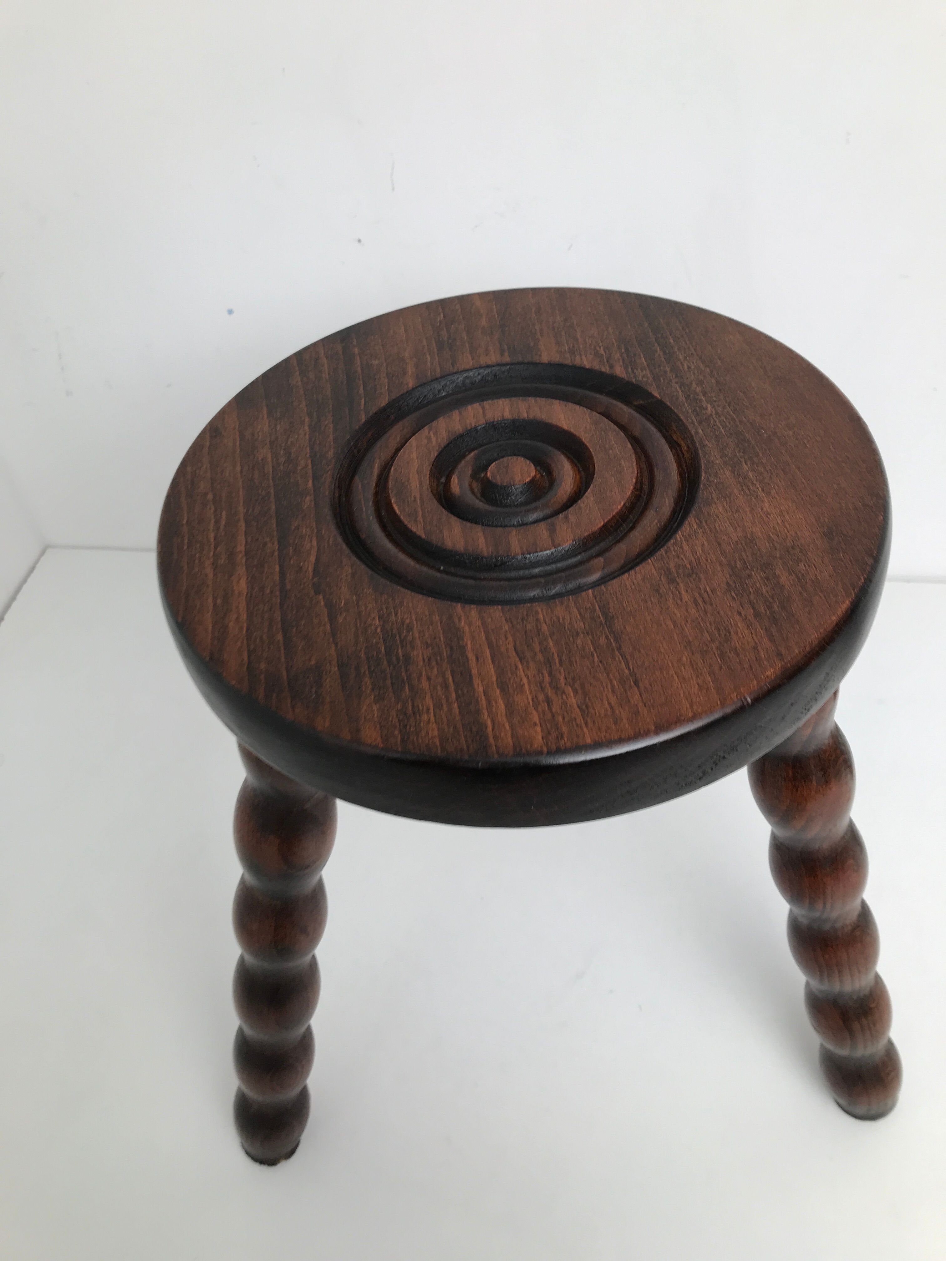 Wooden stool turned tripod foot