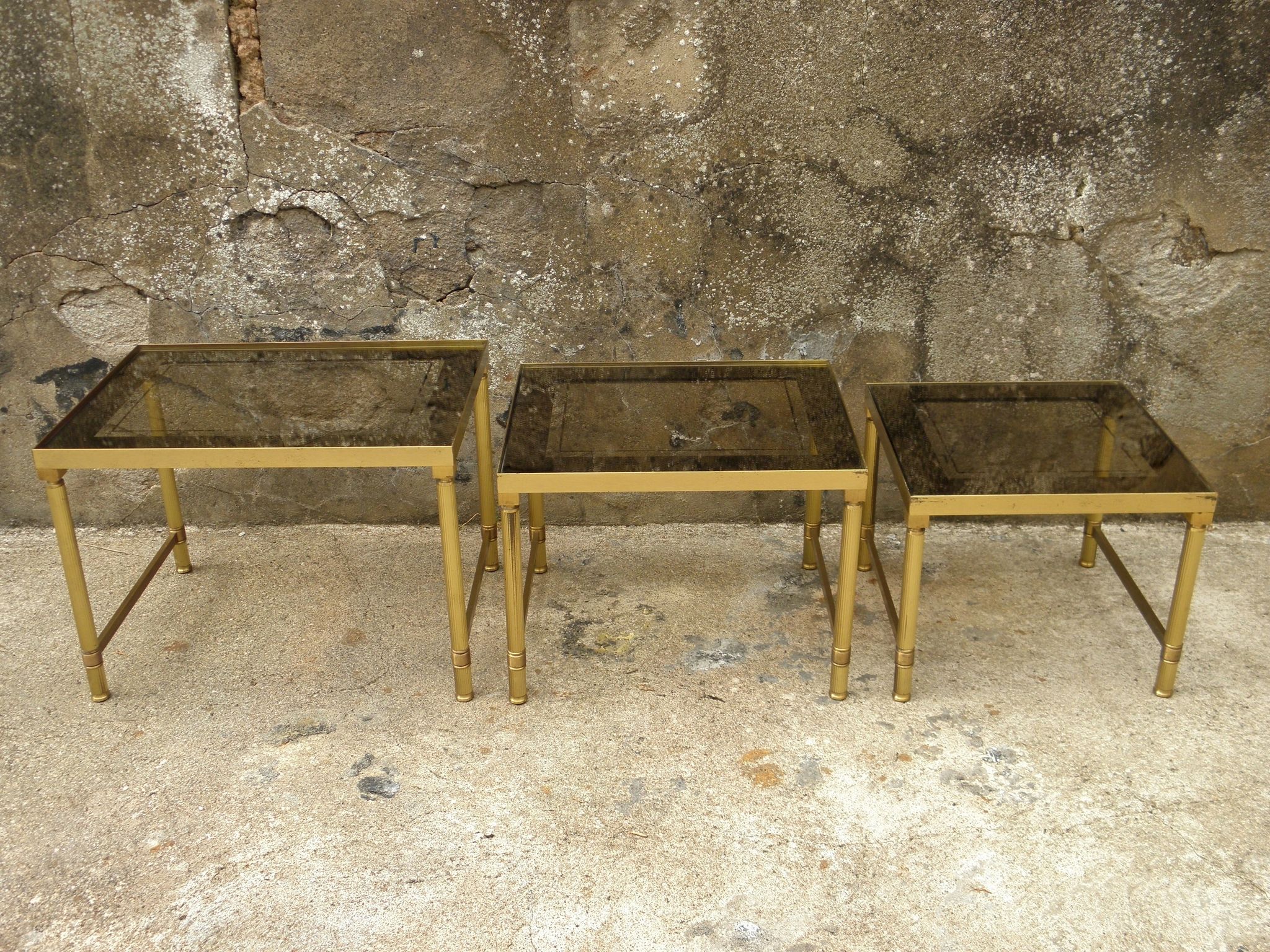 Brass, gold metal and 70s mirror glass tables