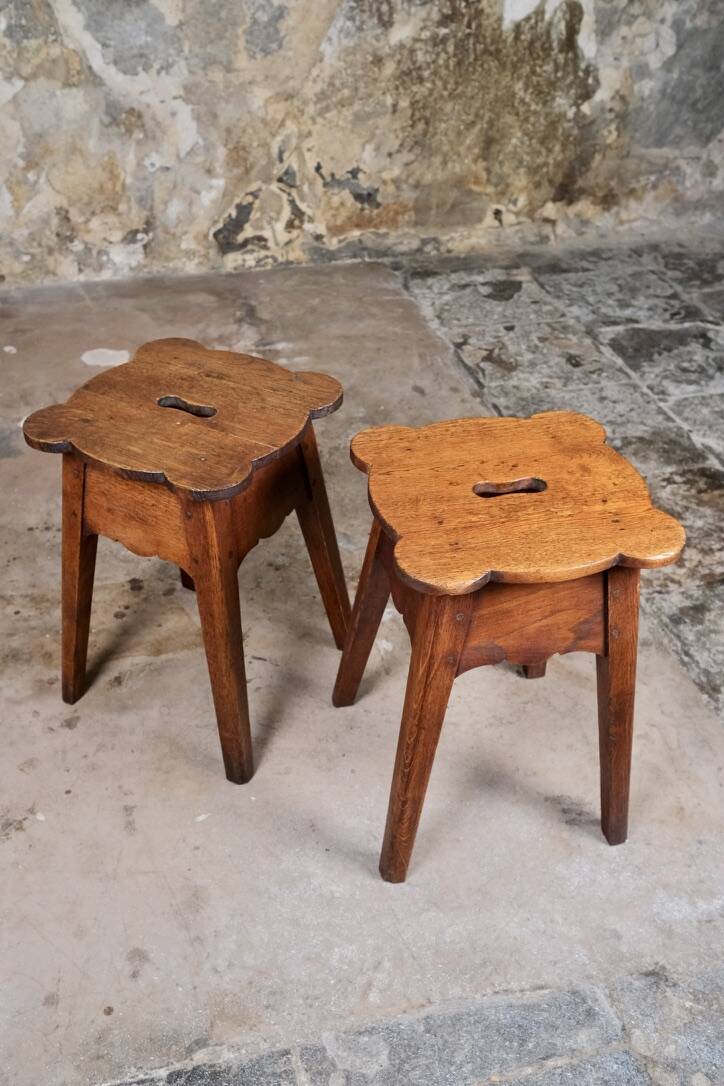Pair of scalloped oak stools, France, early 20th century