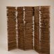 Wooden screen with slats, black plant decoration.