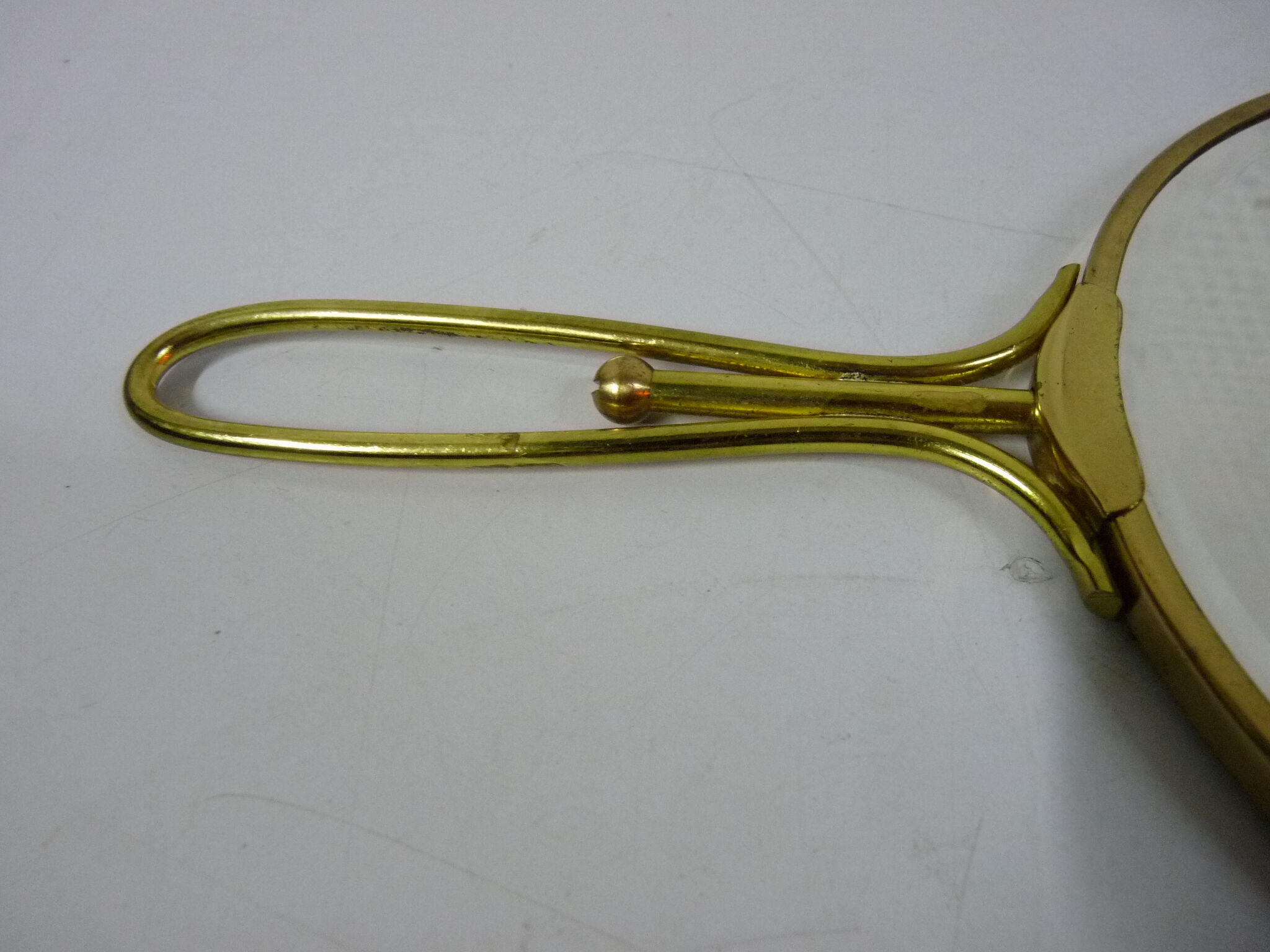 Old mirror double face with golden hand