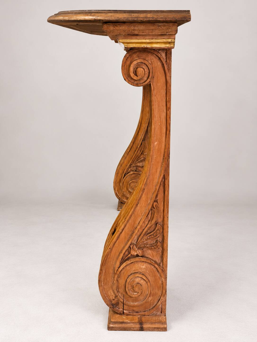Old console in carved wood with scrolls