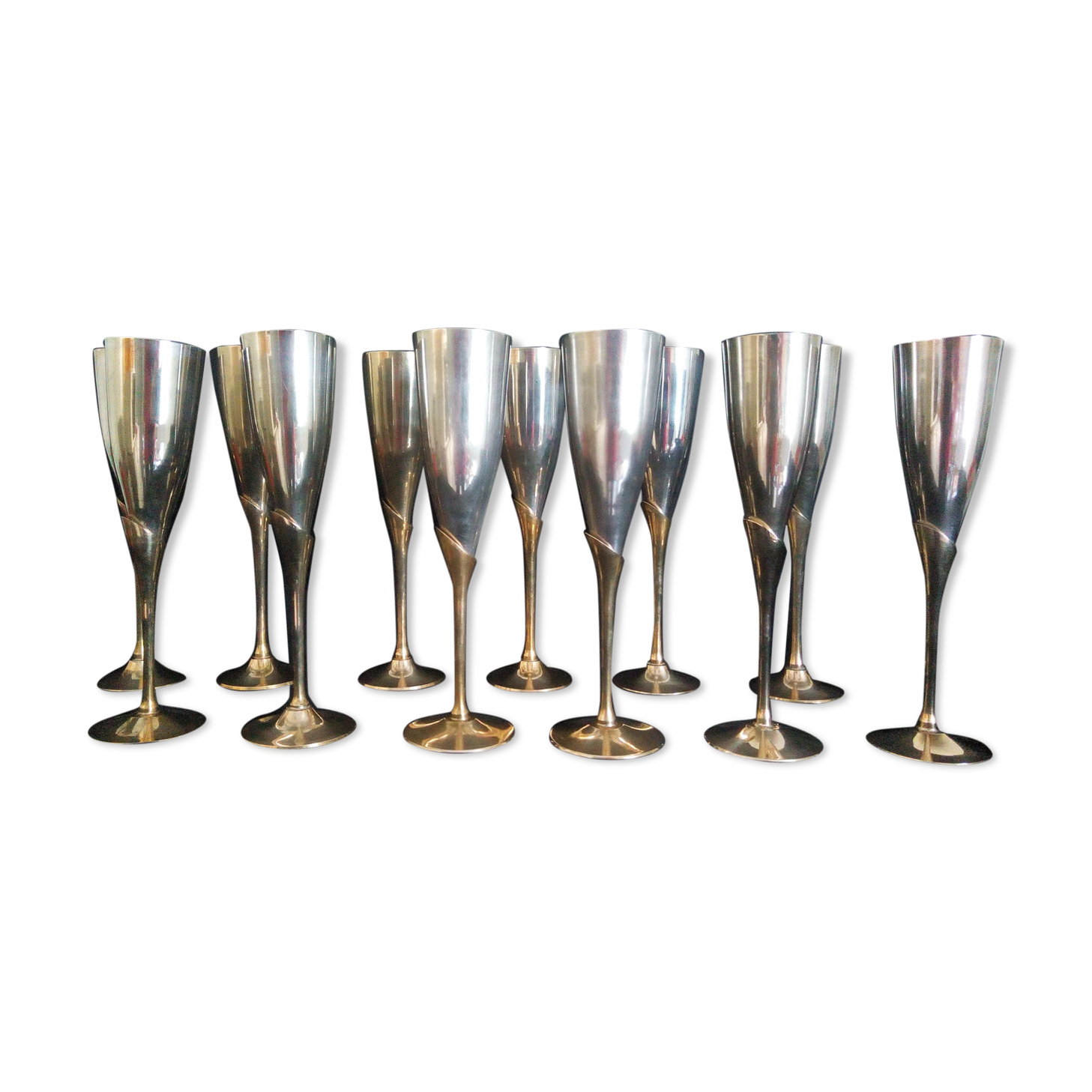 Lot of 12 silver metal flutes on brass stand