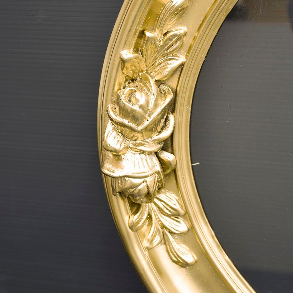 Delightful empty old gilded oval frame with carved wood and stucco flowers 63 x 53