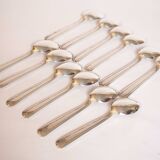 Silver plated metal service: 12 soup spoons, 12 forks and ladle.