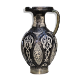 A jar of water pitcher made of tamgroute pottery handmade and adorned with bones.