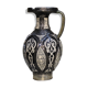 A jar of water pitcher made of tamgroute pottery handmade and adorned with bones.