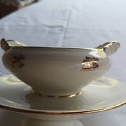 Sells sauceboat Elegant decoration of small golden roses,