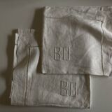 Pair of modernist linen pillowcases embroidered with comic strips